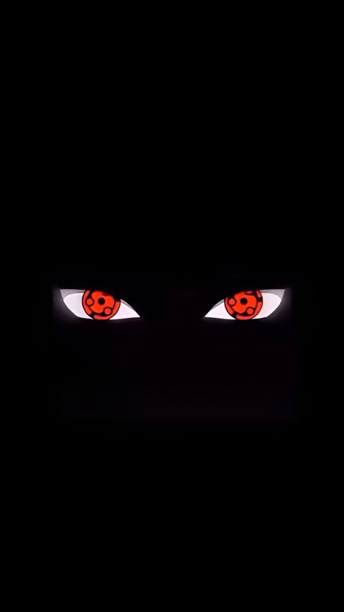 the eyes of an evil looking person in the dark with red light coming from them