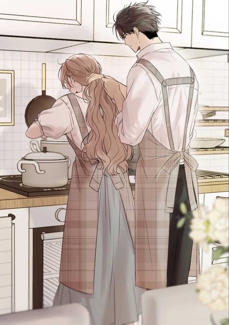 a man and woman standing in a kitchen next to each other, looking at something on the counter