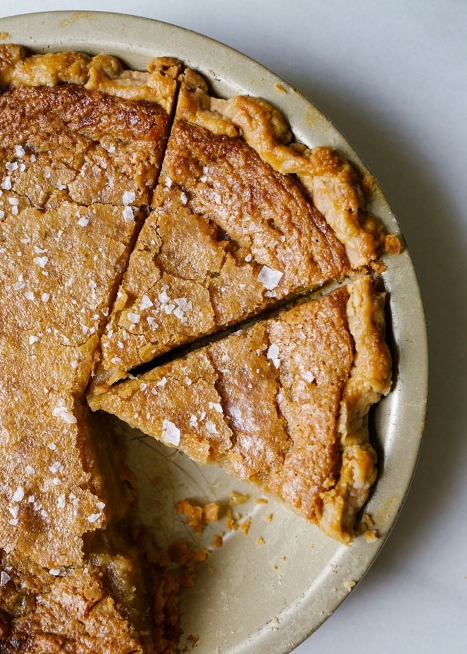 a pie is cut into slices on a plate