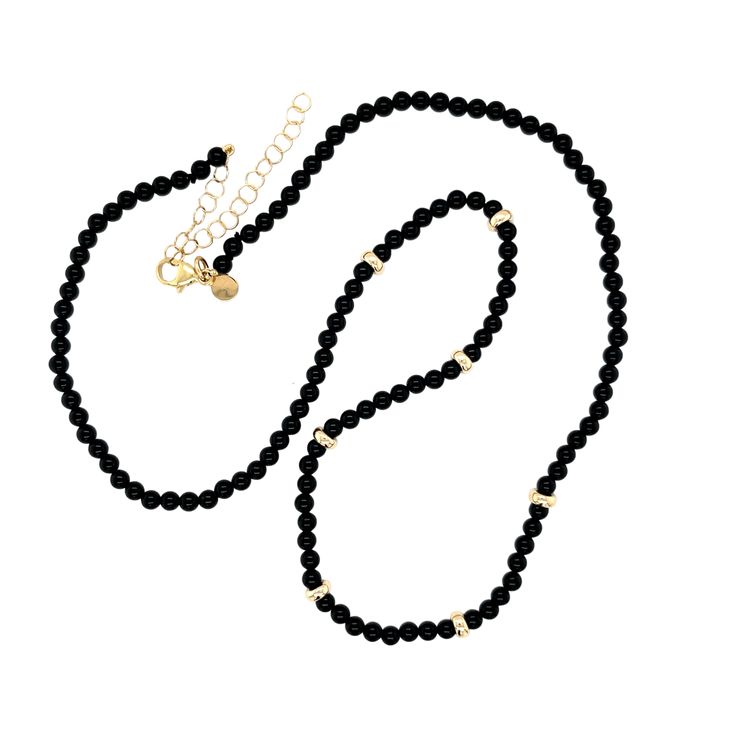 Add a special touch to your summer look! This 14K Gold Bead and Black Onyx Necklace is elegantly segmented with seven shining 14k beads and onyx stones. Size of Black Onyx Bead: Approx. 3mm Length: 16"-18" adjustable 14k yellow gold clasp and chain extension Elegant Onyx Necklace With Polished Beads, Gold Onyx Beaded Necklaces With Black Beads, Gold Beaded Necklace With Black Onyx Beads, Gold Onyx Beaded Necklace With Black Beads, Elegant Black Beads With Gold Details, Elegant Black Jewelry With Gold Beads, Elegant Onyx Beaded Chain Necklace, Elegant Onyx Beaded Necklace, Elegant Black Beaded Chain