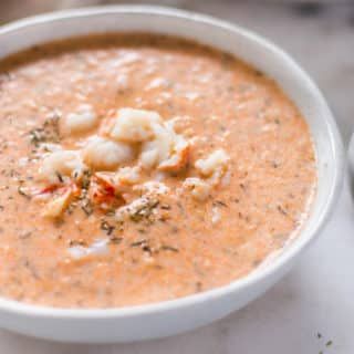 a white bowl filled with soup on top of a table