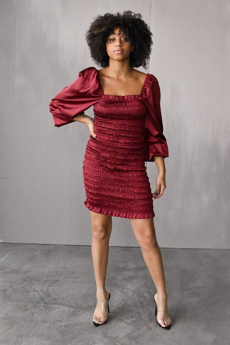 Take your holiday style up a notch with a silky ruched mini dress in a luxe burgundy satin fabric. Designed with a square neckline and soft blouson sleeves. Hits mid thigh. Satin Mini Dress With Square Neck For Date Night, Satin Square Neck Mini Dress For Date Night, Ruched Balloon Sleeve Dresses For Night Out, Flirty Puff Sleeve Dress For Party With Gathered Sleeves, Square Neck Dresses For Night Out In Fall, Square Neck Dresses For Fall Night Out, Evening Mini Dress With Ruched Balloon Sleeve, Evening Mini Dress With Balloon Sleeves And Ruched Detail, Satin Puff Sleeve Dress For Night Out