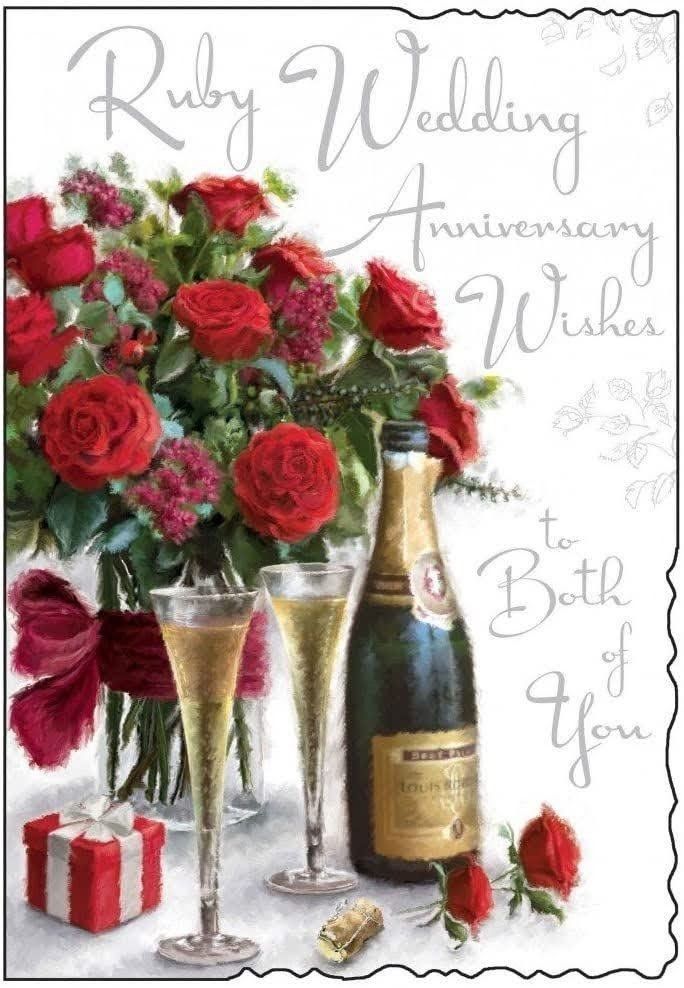 a wedding anniversary card with roses and champagne