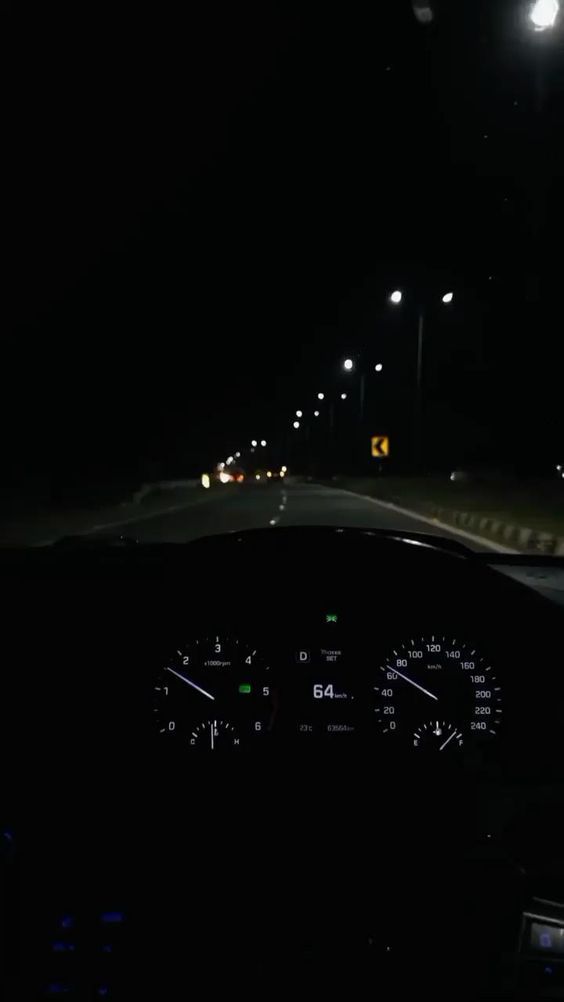 the dashboard of a car at night time