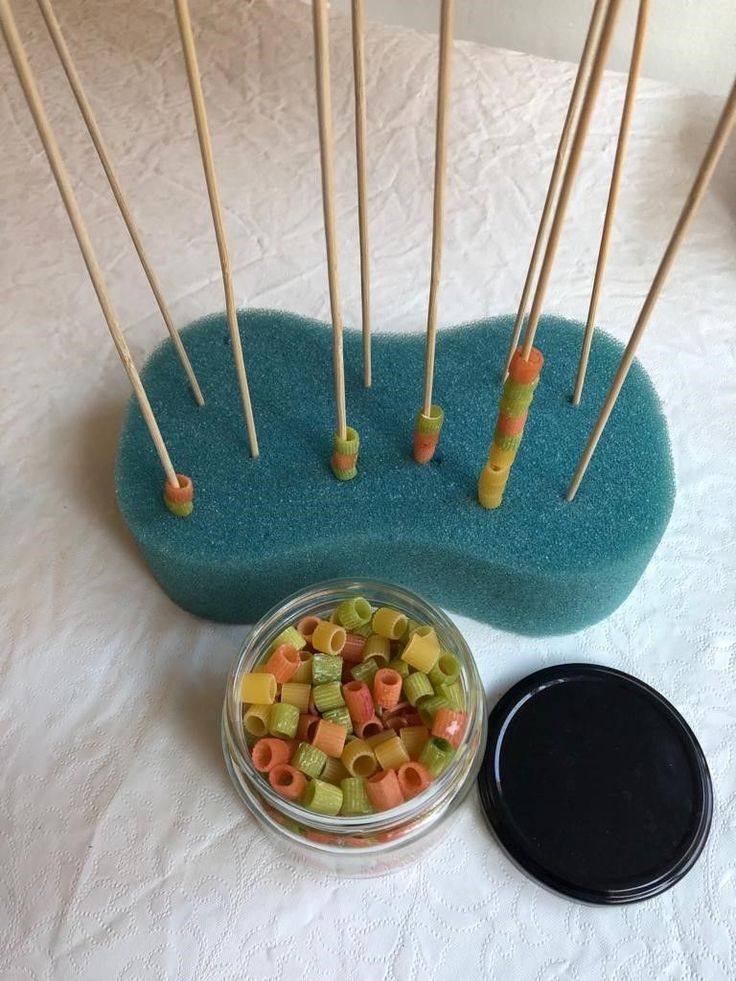 there are many toothpicks in the bowl and on the table next to it