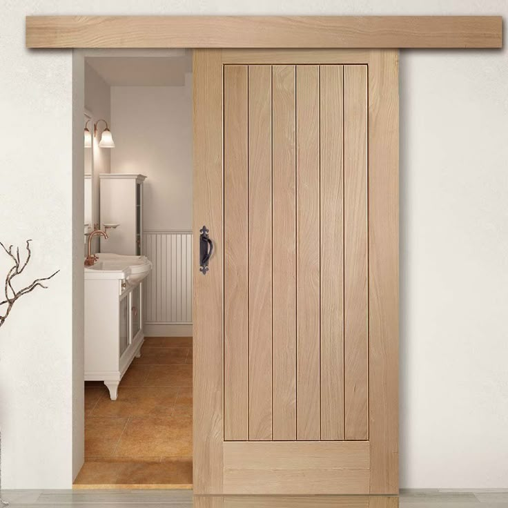 an open wooden door in a white room