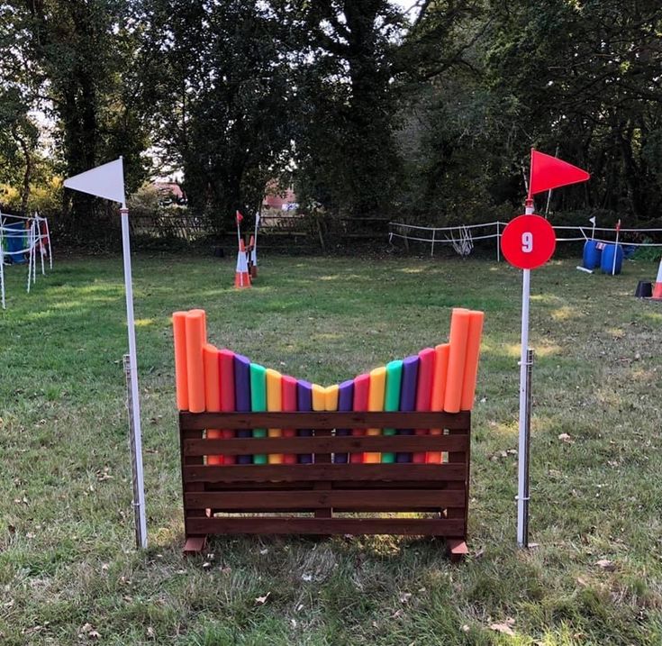 an obstacle course with colorful sticks and markers