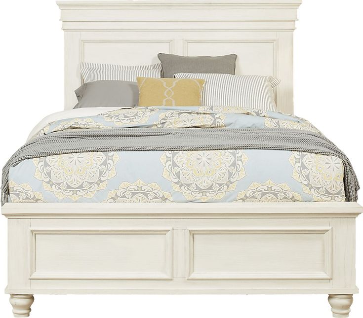 a white bed with drawers underneath it and pillows on the headboard, in front of a white background