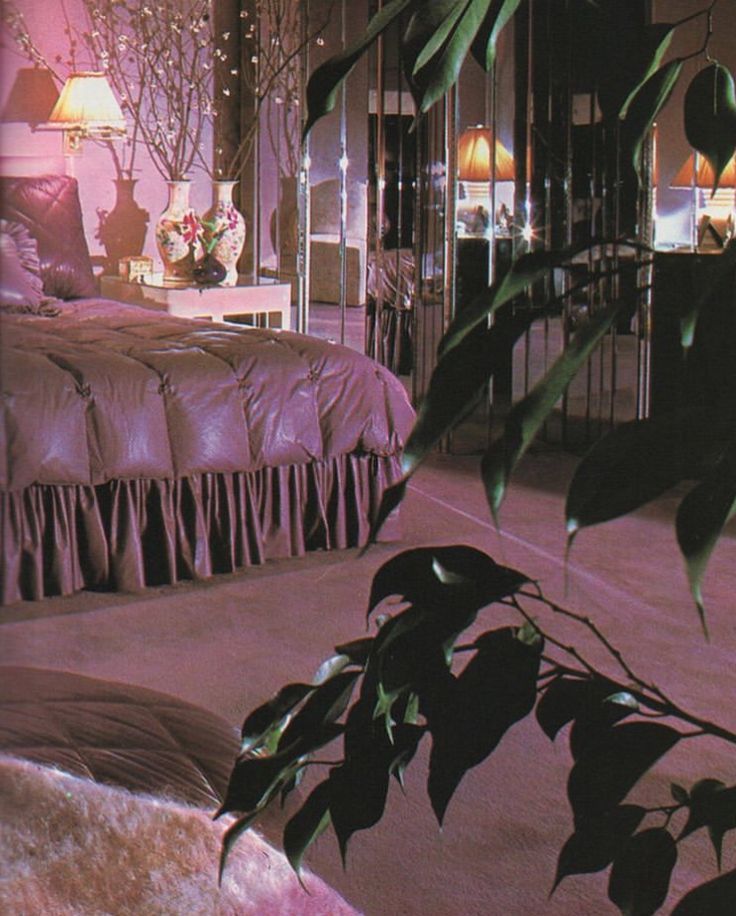 the bedroom is decorated in pink and purple tones