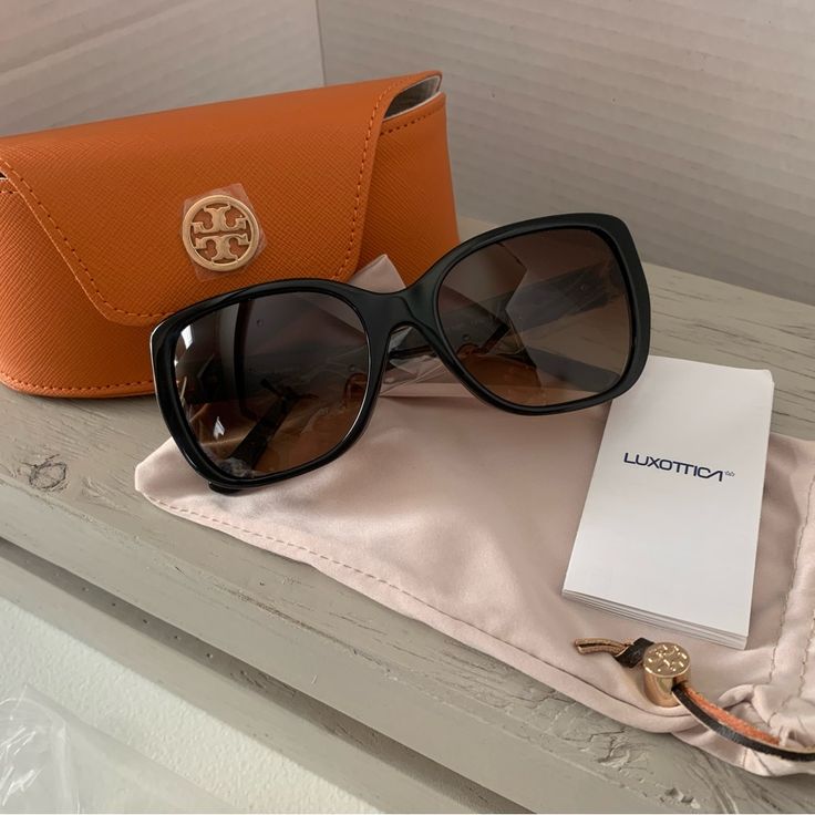 Tory Burch Sunglasses Leather Case W/ Magnetic Closure & Dust Bag Shape: Rectangle Gender: Female Material: Acetate Bridge Type: Full Rim Color Description: Black Frame Color: Black Lens Color: Brown Gradient Eye/Bridge/Temple 55/18/135 Classic Brown Sunglasses For Evening, Brown Glass Sunglasses For Evening, Formal Brown Acetate Sunglasses, Elegant Brown Rectangular Sunglasses, Brown Square Frame Sunglasses For Evening, Elegant Brown Sunglasses For Formal Occasions, Elegant Brown Sunglasses With Square Frame, Designer Brown Evening Sunglasses, Elegant Square Frame Sunglasses For Travel