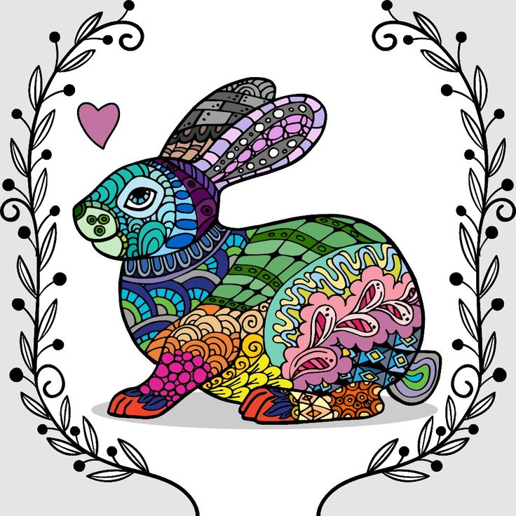 a colorful rabbit sitting in a floral frame