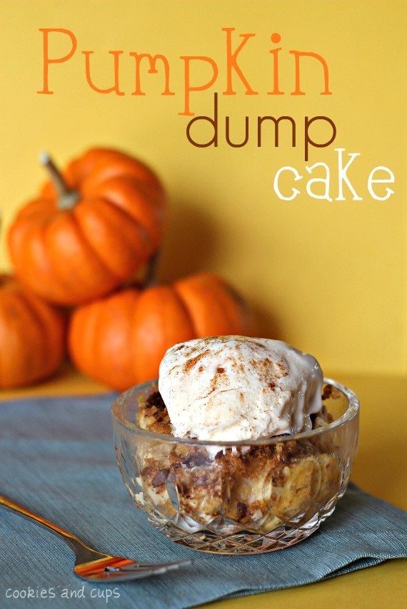 pumpkin dump cake in a glass bowl on top of a blue napkin