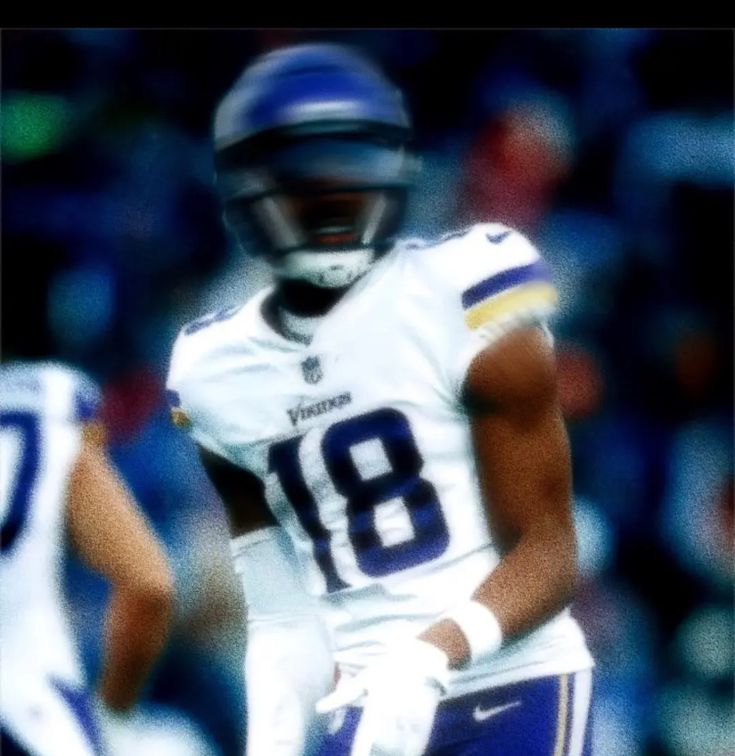 a blurry photo of a football player on the field