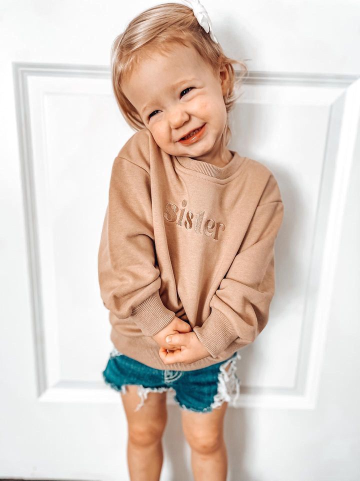 Join the cozy crew! Our Sister Embroidered Crewneck Sweatshirt is made from soft, French-terry cotton, perfect for snuggles with the fam. With a neutral color and elastic waist and cuffs, it's available for all members of the pack. Don't sweat it, grab one for everyone! Runs TTS. Embroidered Crewneck, Embroidered Sweatshirts, French Terry, Crewneck Sweatshirt, Crew Neck Sweatshirt, Crew Neck, Elastic, Sweatshirts