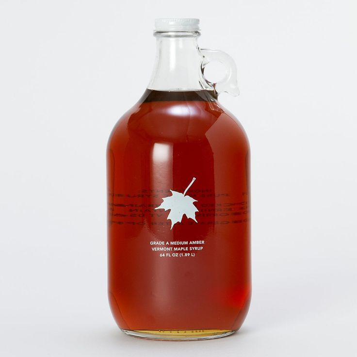 a bottle of maple syrup on a white background