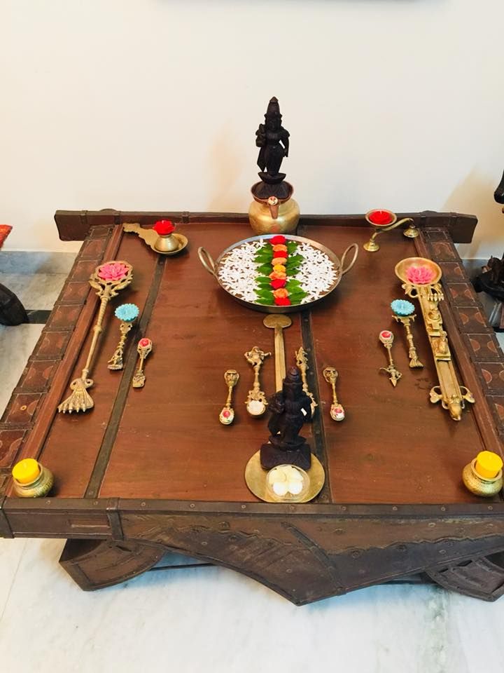 a wooden table topped with lots of different types of utensils and spoons