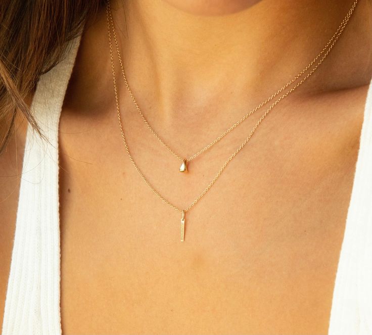 Extremely dainty, this necklace is perfect for a barely there look. The charm is solid 14k yellow gold. The chain is available in 14k gold filled (for a more budget friendly option) or in solid 14k gold. Hair Cuffs, Teardrop Necklace, Chain Anklet, Gold Filled Chain, Ring Bracelet, Budget Friendly, Anklets, Gold Filled, Gift Card