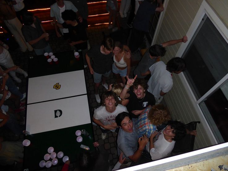 a group of people standing around at a party