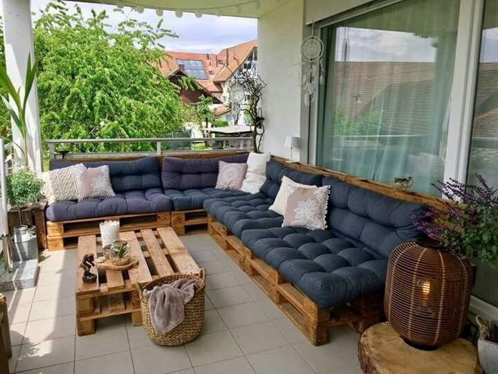 a couch sitting on top of a wooden pallet