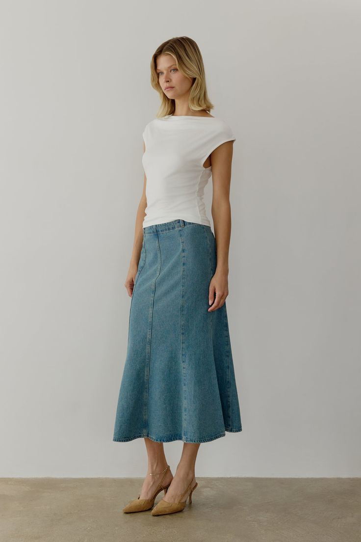 Information The Aeris Skirt is a mermaid denim midi skirt designed with a mid-rise and fit-and-flare silhouette for a flattering look. Perfect to pair with your favorite everyday tee or an elevated blouse. Details 100% Cotton Side Metal Zipper Closure Mid Waist Fit and Flare Midi Length Non Stretch Denim Kara is 5'10" and wearing a size SMeasurements: 32" Bust, 24.5" Waist, 34.5" HipsStyle #SM5130 Denim Midi Skirt, Winter House, Skirt Design, Online Branding, Midi Length, Lifestyle Brands, Shoe Brands, Stretch Denim, Best Sellers