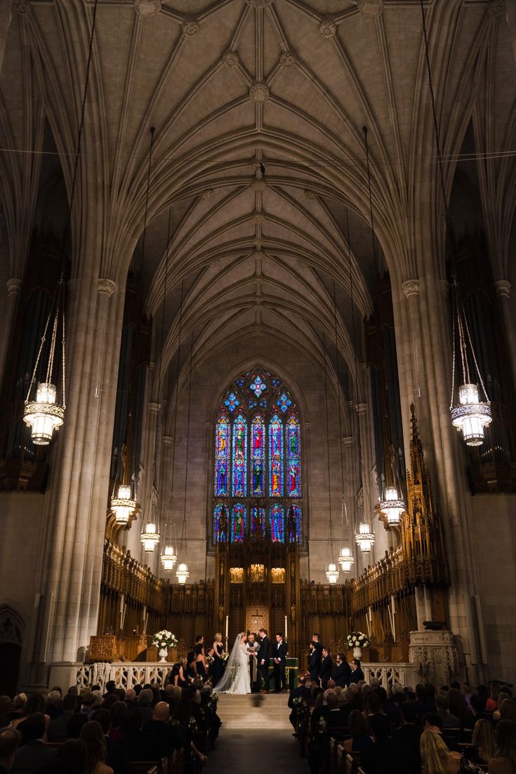 a bride and groom are standing in front of the alter at their church wedding ceremony