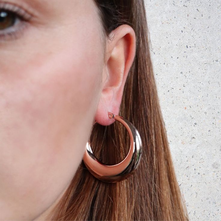 For a simple pair of earrings that always look fabulous, choose these light weight hoop earrings. With a hollow middle, made from stainless steel and finished with 14kt rose gold plating, these earrings are incredibly versatile. We love the shiny, sweet rose gold, and the lightweight feel for all day comfort. Shop these versatile earrings for yourself or for someone special to make a fabulous gift! Clean with a jewellery polishing cloth. Store in a safe place separately to avoid scratching. Rose Gold Polished Hoop Earrings As Gift, Rose Gold Polished Finish Hoop Earrings As Gift, Rose Gold Hoop Earrings Shiny Finish, Rose Gold Hoop Earrings With Shiny Finish, Rose Gold Sterling Silver Hoop Earrings With Polished Finish, Rose Gold Polished Sterling Silver Hoop Earrings, Rose Gold Shiny Hoop Earrings, Everyday Rose Gold Tarnish Resistant Hoop Earrings, Everyday Tarnish Resistant Rose Gold Hoop Earrings