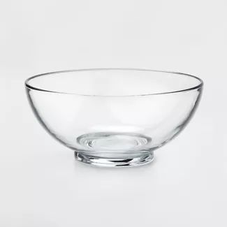 a glass bowl sitting on top of a white table