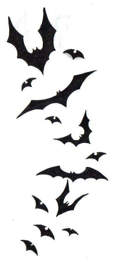 black bats flying in the sky on a white background