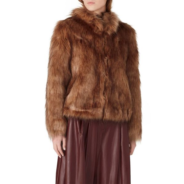 Mocha brown faux fur (80% Acrylic, 20% Modacrylic). Jacket. Long sleeves. Pockets. Satin lining. 21" from shoulder to hemline. Imported. Brown Faux Fur Winter Outerwear, Brown Fur Coat With Faux Fur Lining, Brown Faux Fur Outerwear With Feather Trim, Brown Fur Coat With Faux Fur Trim, Fall Mink Color Fur Coat With Faux Fur Trim, Brown Long Sleeve Fur Coat With Faux Fur Trim, Chic Brown Fur Coat With Faux Fur Lining, Chic Brown Fur Coat With Faux Fur Trim, Brown Fur Coat With Faux Fur Trim For Winter