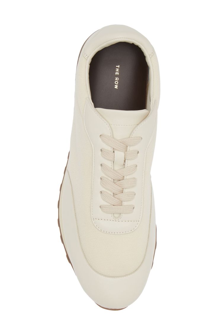 Comfort is job one for this sneaker featuring a knit upper with leather at the toe, heel, tongue and lacing cage and a cushy contrast sole. Lace-up style Removable insole Textile and leather upper and lining/rubber sole Made in Italy Women's Designer Shoes Cream Custom Sneakers With Textured Sole, Cream Leather High-top Sneakers Sporty Style, Cream Leather High-top Sneakers, Sporty Cream Leather High-top Sneakers, Sporty Cream Leather Custom Sneakers, Cream Lace-up Leather Platform Sneakers, Cream Leather Platform Sneakers With Contrast Sole, Cream High-top Lace-up Sneakers With Rubber Waffle Outsoles, Sporty Cream Leather Platform Sneakers