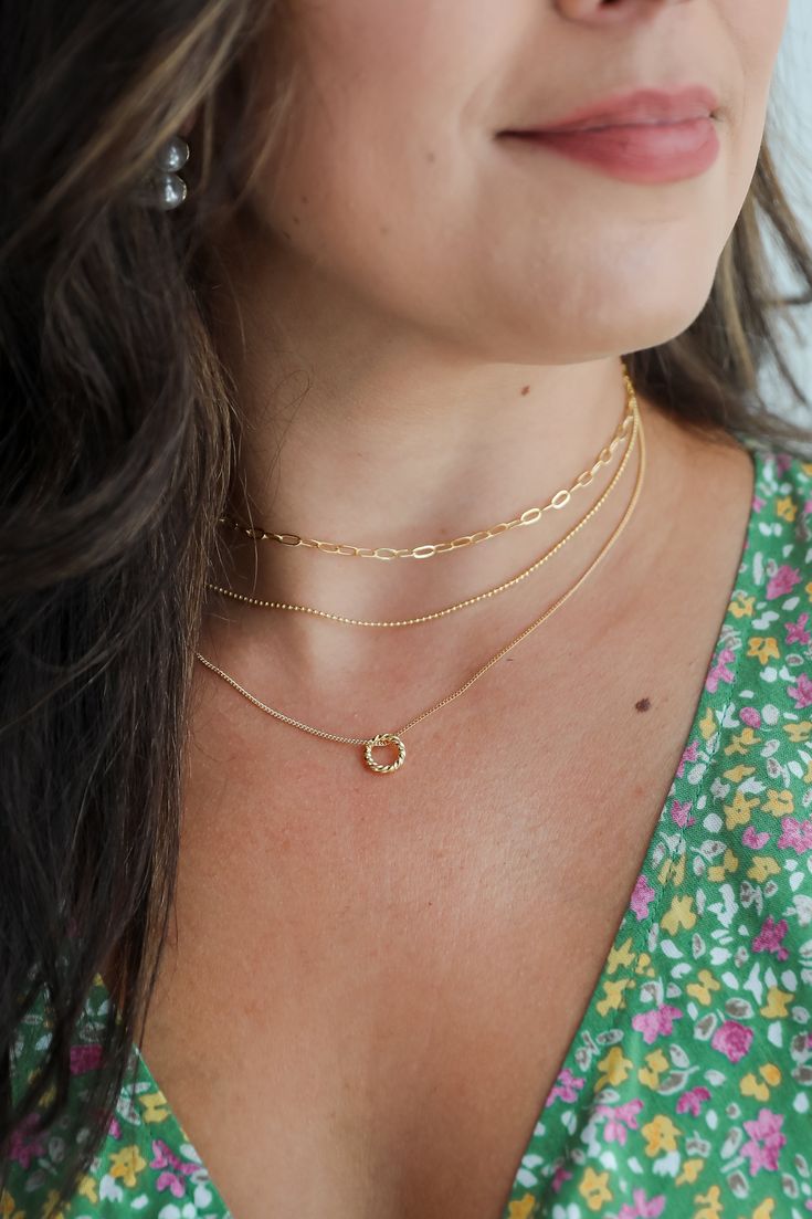 Adding the Maddy Gold Layered Chain Necklace to any 'fit is the easiest way to go from cute to wow-worthy! This trendy necklace features three layers of gold chains with a circle charm on the end. Style the Maddy Necklace with any outfit to instantly upgrade your look! Gold Plated Layered Circle Charm Lobster Clasp with Extender Layer 1 | Length 8" Layer 2 | Length 6.5" Layer 3 | Length 6" Extender | Length 3" Sneaker Heels Wedges, Necklace Trendy, Layered Chain, Layered Chain Necklace, Trendy Necklace, Cute Handbags, Layered Chains, Trendy Necklaces, Way To Go