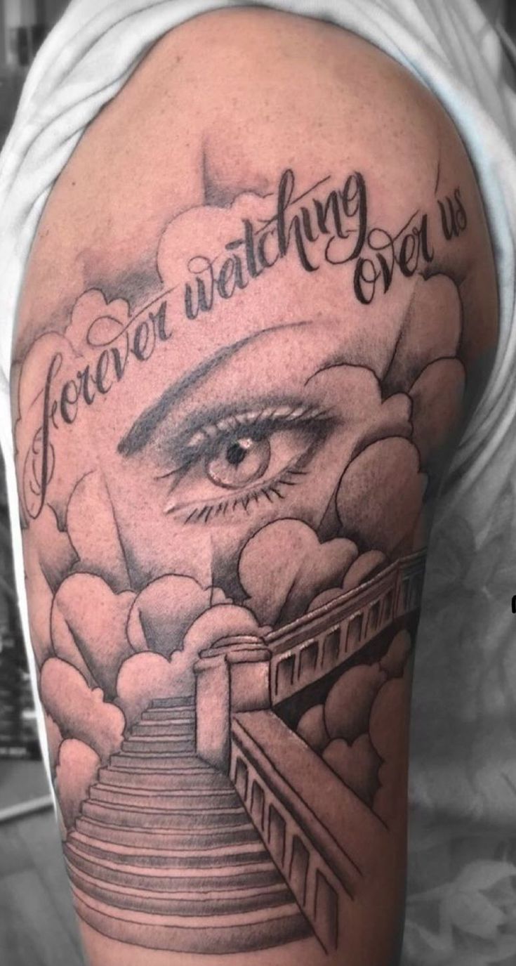 a man's arm with an eye on it and the words, forever watching over us