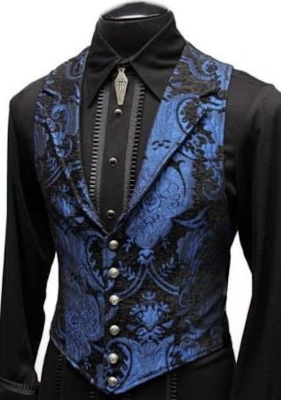 "An elegantly tailored Victorian men's vest made of high quality blue and black tapestry fabric and rich black satin backing and interior lining.  The vest fastens in the front with metal buttons and has satin belting in the back for tightening the waist Great to be worn under a jacket, cloak, cape or by itself. Size small = chest 39″ waist 36″ Size medium = chest 42″ waist 38″ Size Large = chest 45″ waist 40″ Size XL = chest 48\" waist 43\"" Lucifer Clothes, Aristocrat Vest, Goth Men, Black Tapestry, Purple Suits, Steampunk Accessories, Purple Outfits, Steampunk Clothing, Mens Vests