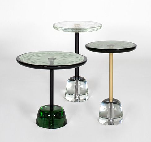 three glass tables sitting on top of each other