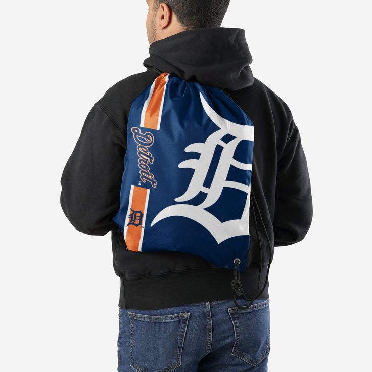 Whether you're going to work, class, or the gym, make sure you always put the team on your back. Literally. Store your stuff and show off your team spirit with this Detroit Tigers Big Logo Drawstring Backpack. Features Easy adjustable cinch top cords to make storing your stuff quick and easy Screen printed design so everyone knows who you're rooting for on gameday Details Dimensions: Approximately 18 in. x 14 in. Volume: Approximately 4L Officially licensed Imported Detroit Tigers Hat, Screen Printing Designs, Detroit Tigers, Going To Work, Your Back, Printed Design, The Gym, Team Spirit, Drawstring Backpack