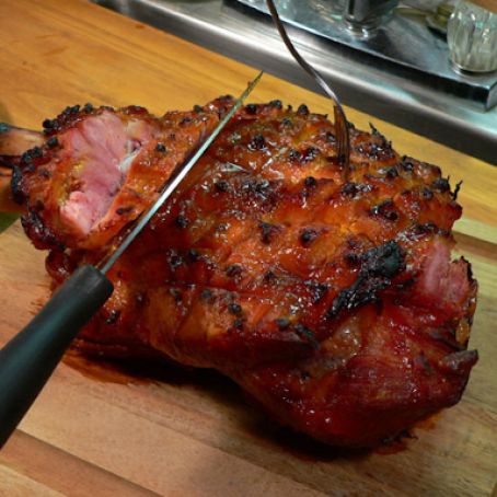 a large piece of meat being cut with a knife