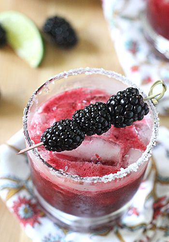 a close up of a drink in a glass on a table