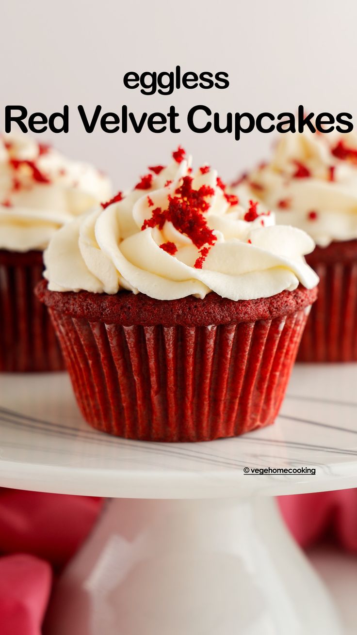 red velvet cupcakes with white frosting and sprinkles on top