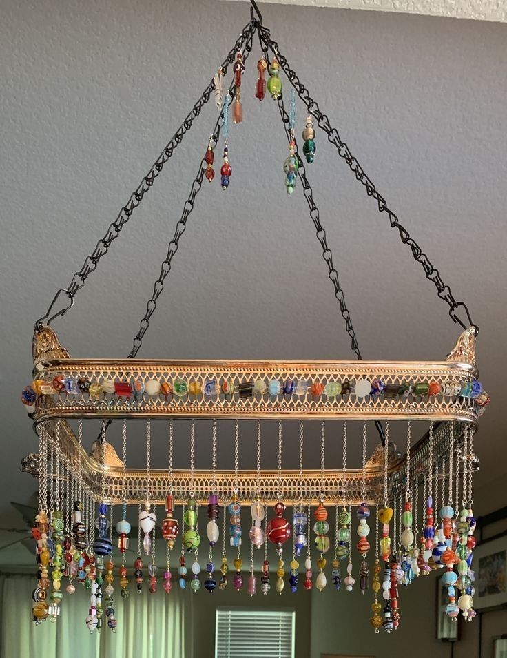 a chandelier hanging from the ceiling in a living room