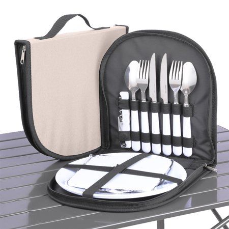 a lunch bag with utensils in it sitting on a picnic table next to a napkin and fork