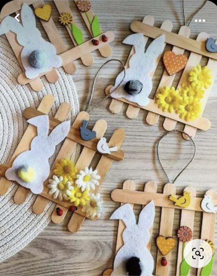 wooden pegs are decorated with easter bunnies and flowers