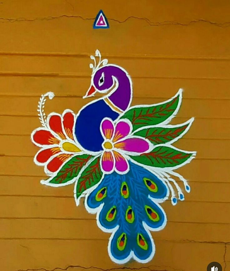 a colorful peacock painted on the side of a building