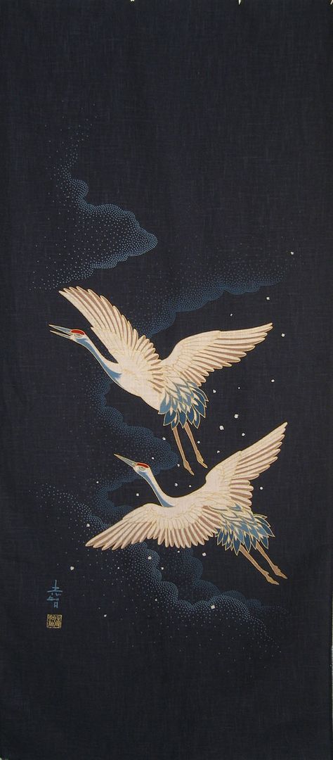 two white birds flying through the night sky