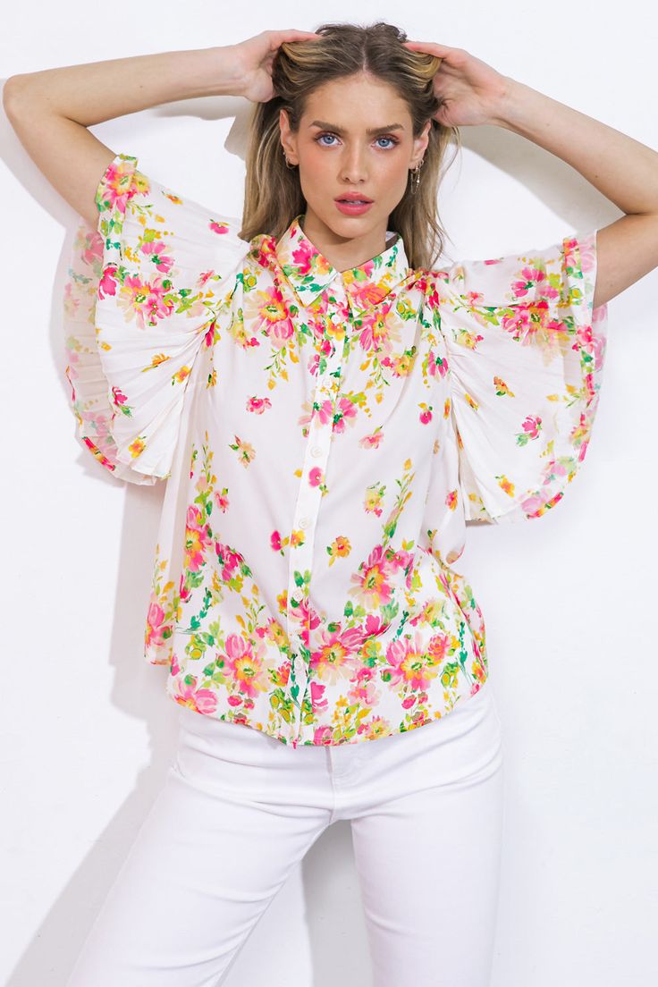 Experience effortless elegance in this intricately crafted woven top, with its refined shirt collar, delicate pleated sleeves, and classic button-down design.Details:Self : 100% PolyesterSize & Fit- Model is 5`8" And Wearing Size Small- Measurements Taken From Size Small- Approx. Length: 24" Summer Feminine Blouse With Ruffle Sleeves, Feminine Summer Blouse With Ruffle Sleeves, Casual Summer Blouse With Pleated Sleeves, Spring Daywear Blouse With Ruffle Sleeves, Summer Formal Tops With Pleated Sleeves, Pleated Tops For Summer Day Out, Spring Tops With Pleated Sleeves For Day Out, Spring Pleated Sleeve Top For Day Out, Feminine Ruffle Sleeve Blouse For Day Out