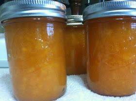 two jars filled with food sitting on top of a white towel