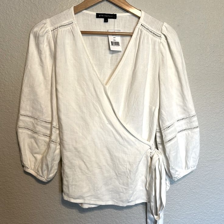 Gibsonlook Ivory Wrap Peasant Top 3/4 Sleeve Size Small Waist Wrap Flaws- See Last Two Photos Spring Cream Linen Blouse, Cream Linen Blouse For Spring, Cream Linen Blouse For Day Out, Spring Off White Linen Tops, Spring Off-white Linen Top, Off White Linen Spring Tops, White 3/4 Sleeve Blouse For Spring, White Linen Blouse For Fall, White Linen Top For Brunch