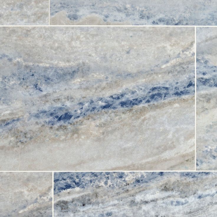 some blue and white marble tiles that are very close together in the same square pattern