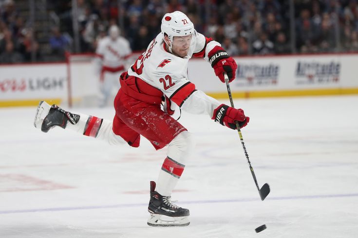 a hockey player in action on the ice