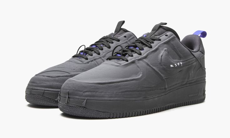 The Nike Air Force 1 Experimental “Black” is a radical look for the retro lifestyle shoe that includes a coated upper and plenty of contemporary design intricacies. A release cooked up by Nike’s future-forward N.354 line, the Air Force 1 Low Experimental in the “Black” makeup imagines what the now-iconic shoe could have looked like had it been released in the present day and not in the early ‘80s. Also referred to as the “Black Tape,” the colorway indeed displays a masking tape-like coating on t Nike Air Force 1 Sporty Streetwear Shoes, Carbon Color Sneakers With Boost Midsole For Streetwear, Sporty Black Sneakers With Recycled Rubber, Carbon Color Round Toe Sneakers For Streetwear, Black Sneakers With Recycled Rubber, Black Sneakers With Recycled Rubber And Round Toe, Black Recycled Rubber Sneakers With Round Toe, Black Recycled Rubber Sneakers, Carbon Color Sneakers With Rubber Sole For Streetwear