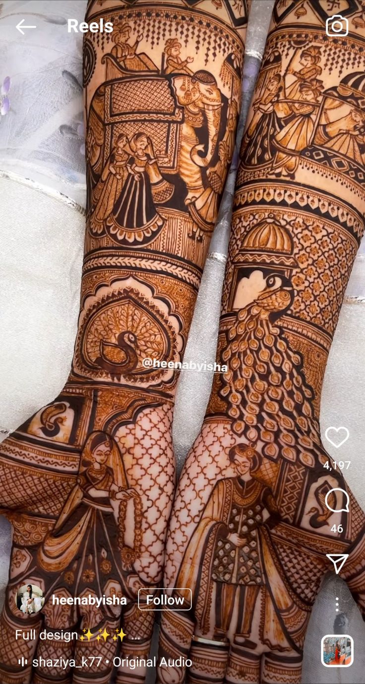 two hands with henna designs on them